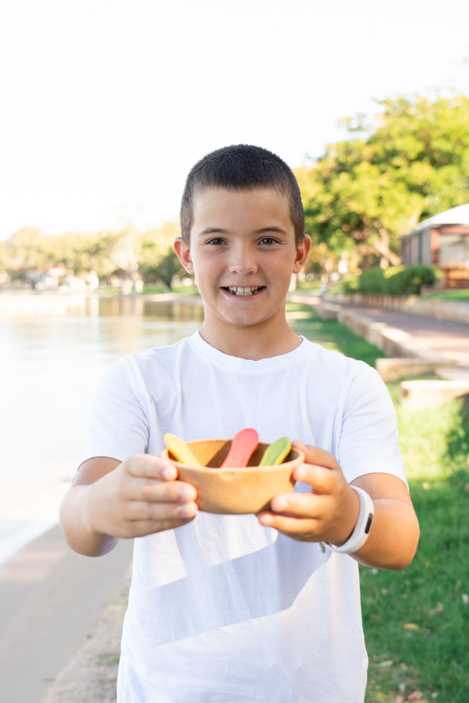 Savouring sweets with a smile, this happy boy enjoys dessert in our edible bowls and spoons!